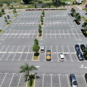 Few,Car,At,Car,Park,In,Otherwise,Empty,Parking,Lot.